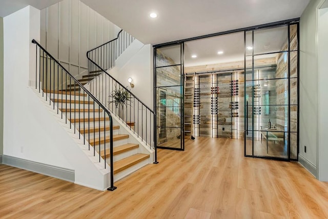 wine room with hardwood / wood-style flooring