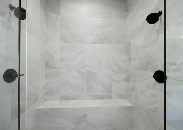 bathroom with a tile shower