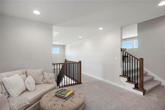 living room with carpet floors and a healthy amount of sunlight