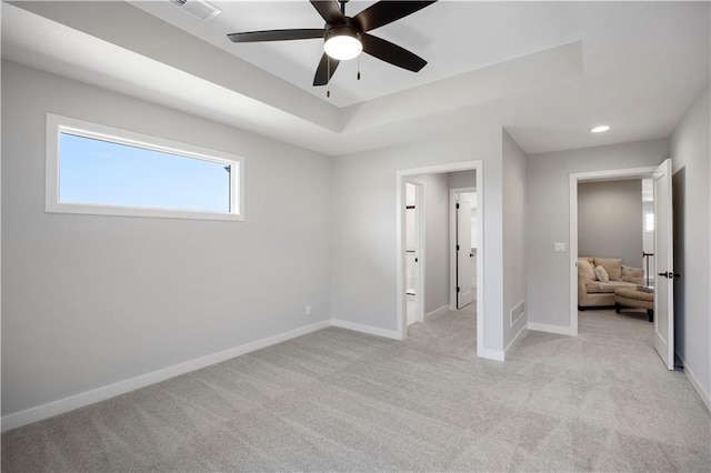 unfurnished bedroom with light carpet and ceiling fan