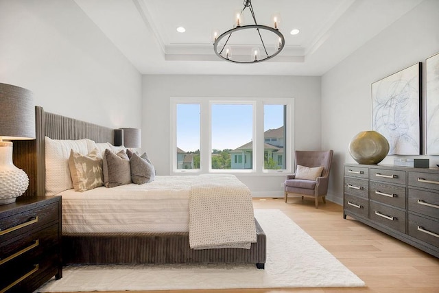8009 Millridge St, Shawnee, KS 66220 - bedroom with a chandelier, light wood-style flooring, a tray ceiling, crown molding, and recessed lighting