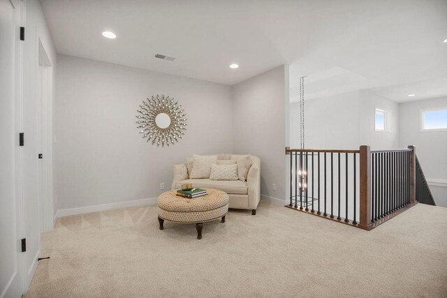8009 Millridge St, Shawnee, KS 66220 - sitting room with carpet floors, recessed lighting, and an upstairs landing
