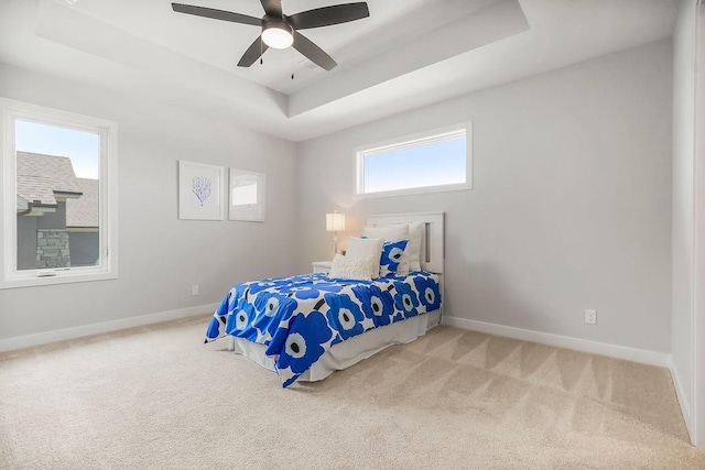 8009 Millridge St, Shawnee, KS 66220 - carpeted bedroom featuring a tray ceiling and ceiling fan
