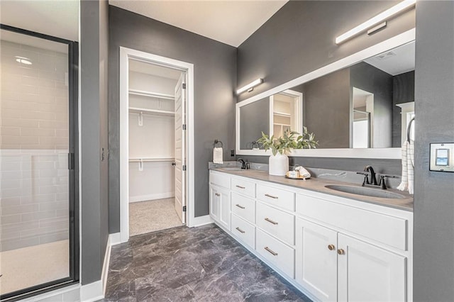 bathroom with vanity and a shower with shower door