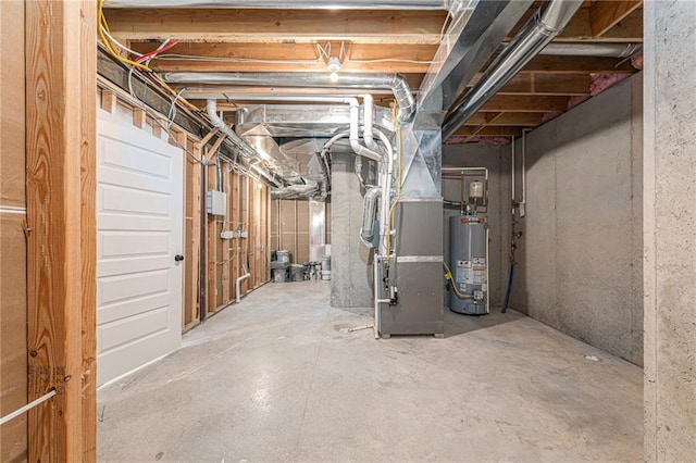 basement featuring heating unit and water heater