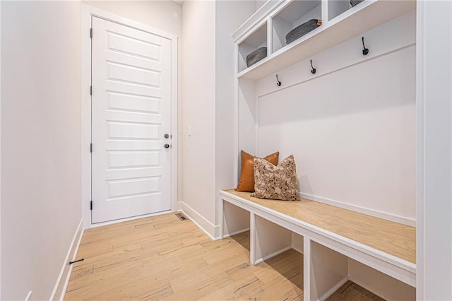 mudroom with light hardwood / wood-style floors