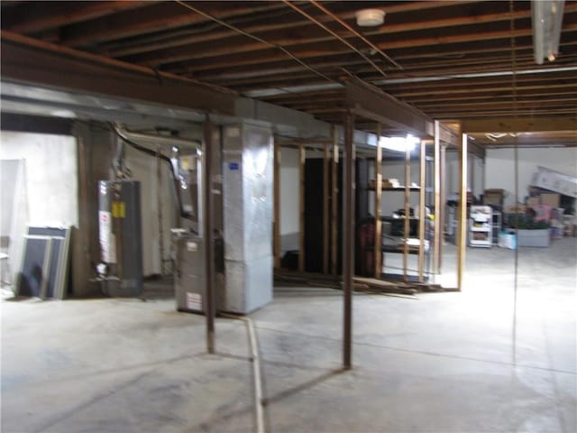 basement with water heater and heating utilities