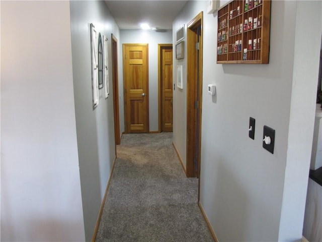 corridor featuring carpet flooring