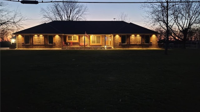 view of front of home with a lawn