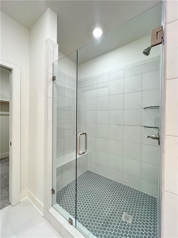 bathroom featuring walk in shower