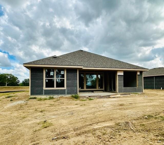 back of property with a patio area