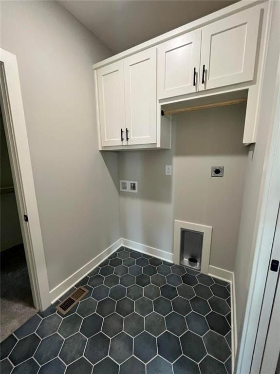 washroom featuring hookup for a washing machine, cabinet space, visible vents, hookup for an electric dryer, and baseboards