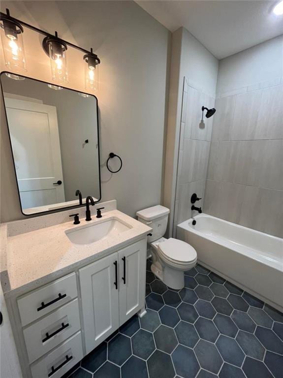 full bath with toilet, tile patterned flooring, shower / washtub combination, and vanity