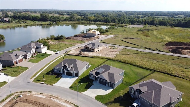 aerial view with a residential view and a water view