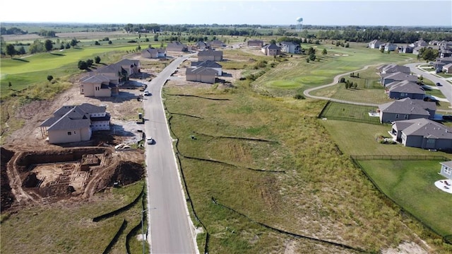 aerial view with view of golf course and a residential view