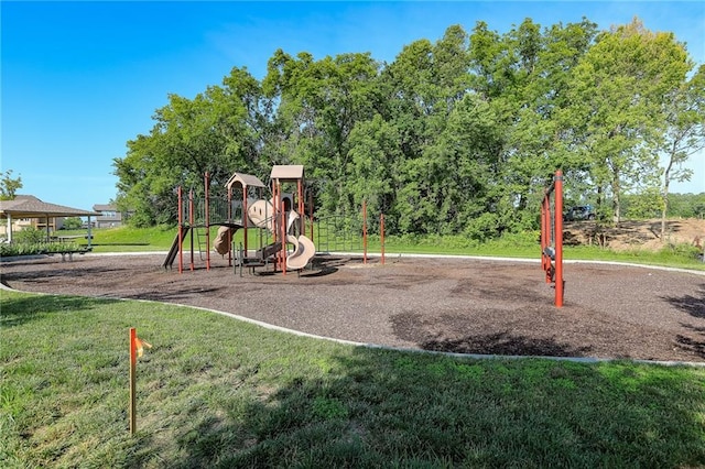 community jungle gym with a yard