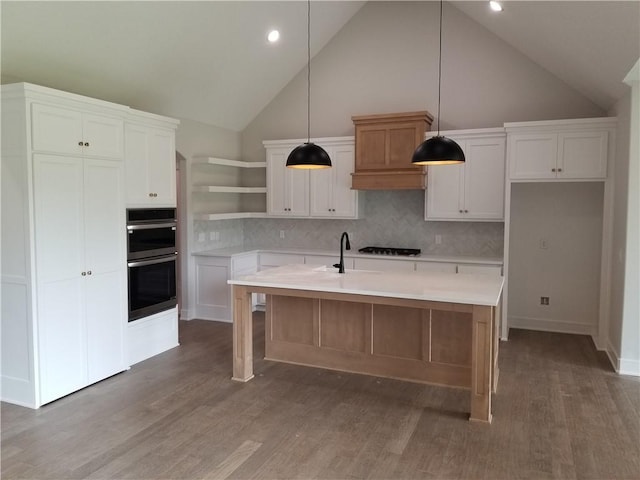 4576 Aspen Dr, Basehor, KS 66007 - kitchen with stainless steel double oven, open shelves, white cabinetry, light countertops, and high vaulted ceiling