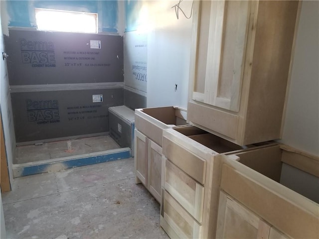 bathroom with concrete flooring