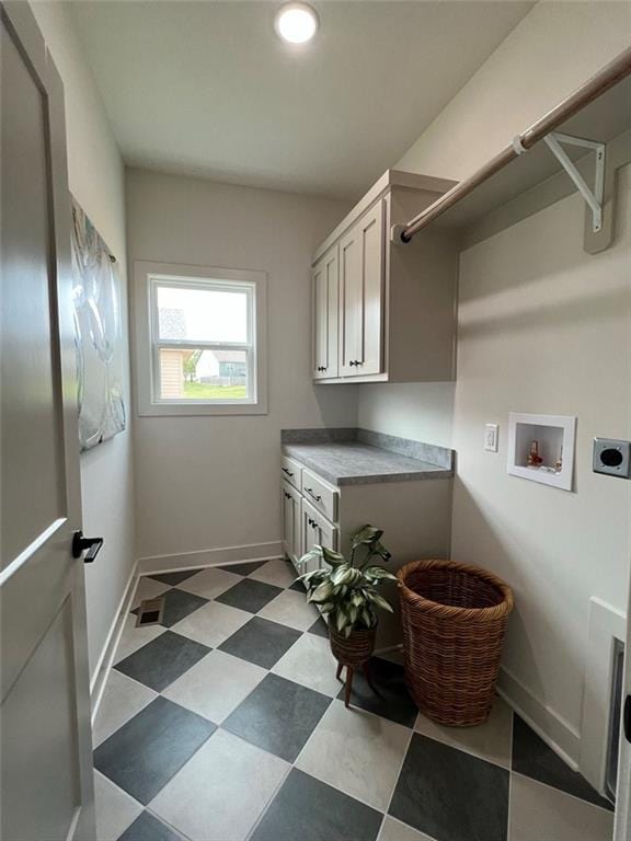 laundry room featuring cabinets, washer hookup, and hookup for an electric dryer