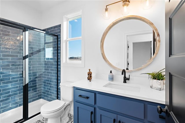 bathroom featuring an enclosed shower, vanity, and toilet