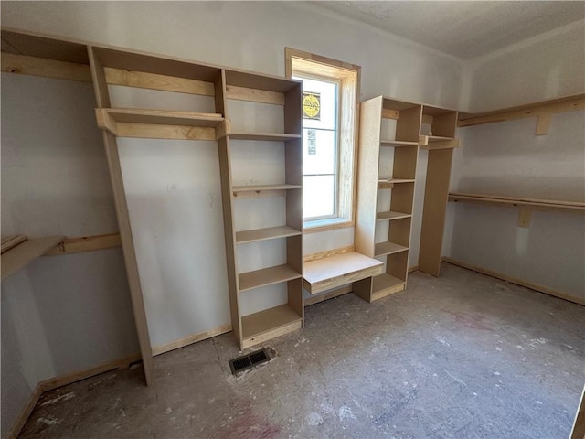 walk in closet with visible vents