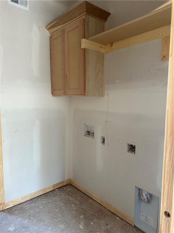 clothes washing area featuring cabinet space, visible vents, baseboards, and hookup for a washing machine