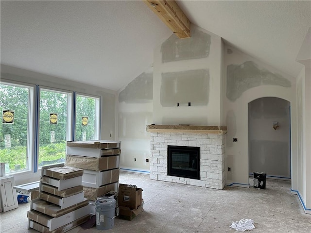 24811 W 178th Ct, Gardner, KS 66030 - living room with a stone fireplace, beam ceiling, high vaulted ceiling, and arched walkways