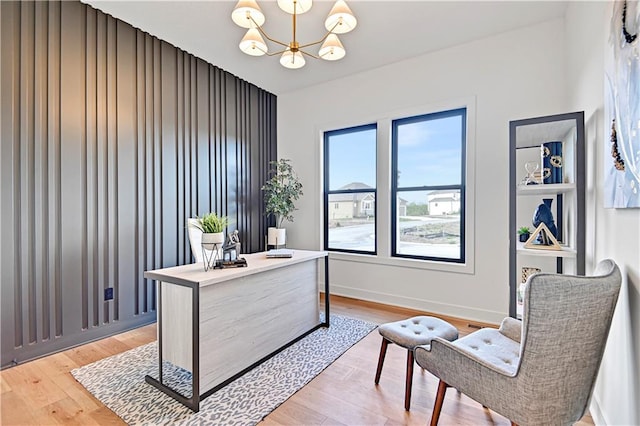 office space with hardwood / wood-style floors and an inviting chandelier