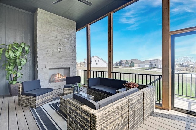 17433 Gillette St, Overland Park, KS 66221 - sunroom with an outdoor living space with a fireplace, ceiling fan, and a residential view