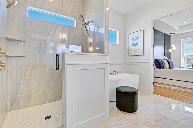 17433 Gillette St, Overland Park, KS 66221 - full bathroom featuring ensuite bathroom, a stall shower, healthy amount of natural light, a soaking tub, and a decorative wall