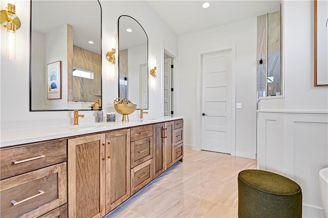 17433 Gillette St, Overland Park, KS 66221 - bathroom featuring double vanity, tiled shower, marble finish floors, and recessed lighting