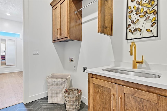 17433 Gillette St, Overland Park, KS 66221 - washroom featuring electric dryer hookup, cabinet space, washer hookup, and baseboards