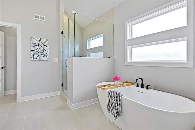 bathroom with plus walk in shower and tile patterned flooring