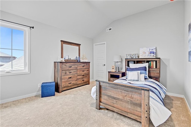 bedroom with carpet flooring and lofted ceiling