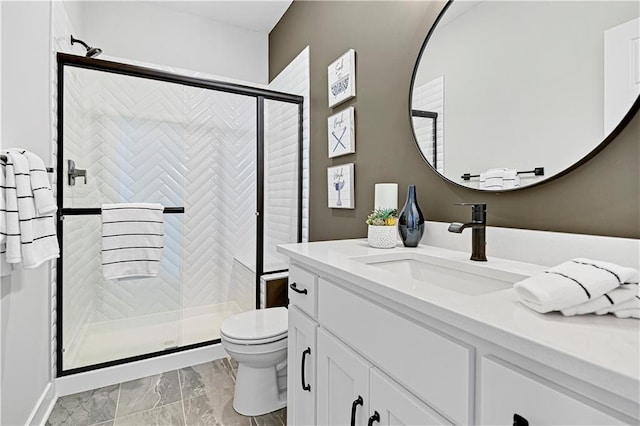 17421 Gillette St, Overland Park, KS 66221 - bathroom with toilet, marble look tiles, a stall shower, and vanity