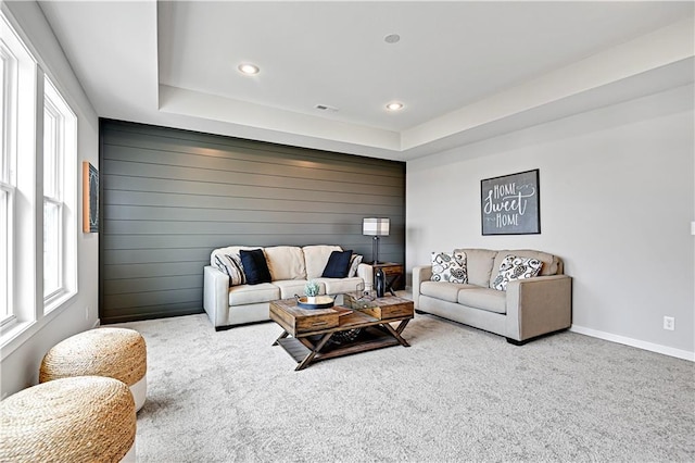 17421 Gillette St, Overland Park, KS 66221 - carpeted living room featuring recessed lighting, a raised ceiling, and baseboards