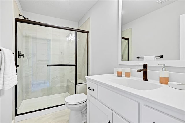 17421 Gillette St, Overland Park, KS 66221 - full bathroom with a shower stall, toilet, and vanity