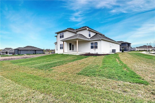17421 Gillette St, Overland Park, KS 66221 - view of front of home with a front yard, stucco siding, and central AC unit