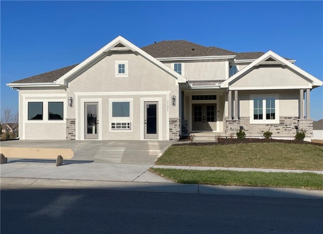 17421 Gillette St, Overland Park, KS 66221 - view of front of house featuring stucco siding, french doors, stone siding, and a front lawn