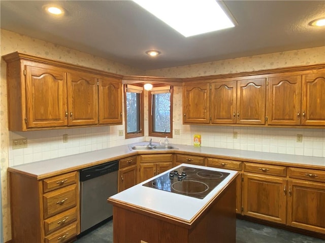 kitchen with a sink, black electric stovetop, brown cabinetry, and dishwasher