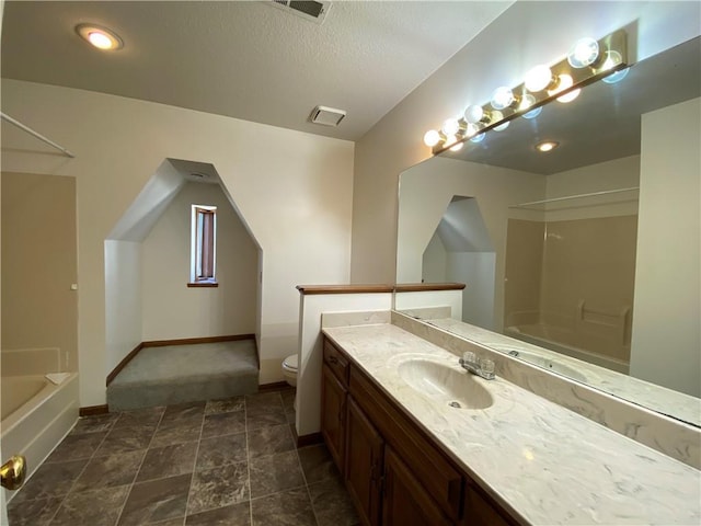 full bathroom with baseboards, visible vents, toilet, vanity, and shower / bathtub combination