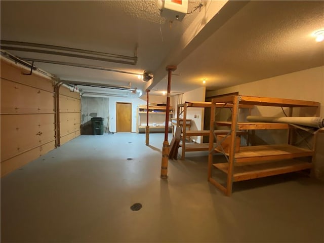 finished basement with a textured ceiling