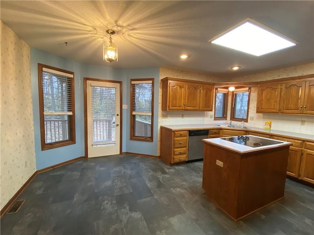 kitchen featuring wallpapered walls, brown cabinetry, a kitchen island, light countertops, and stainless steel dishwasher