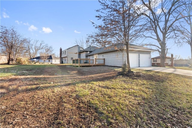 view of front of home with a deck and a front yard