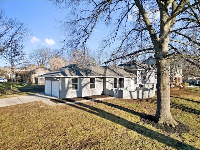 ranch-style home with a front yard and a garage