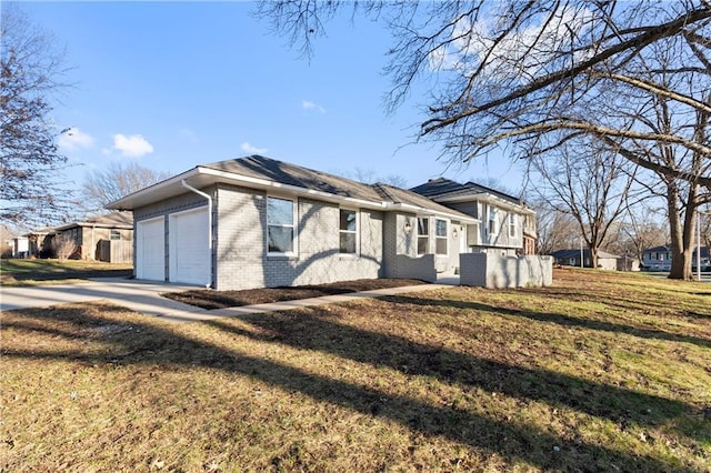 ranch-style home with a front lawn and a garage