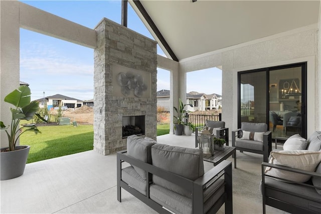 view of patio featuring an outdoor living space with a fireplace