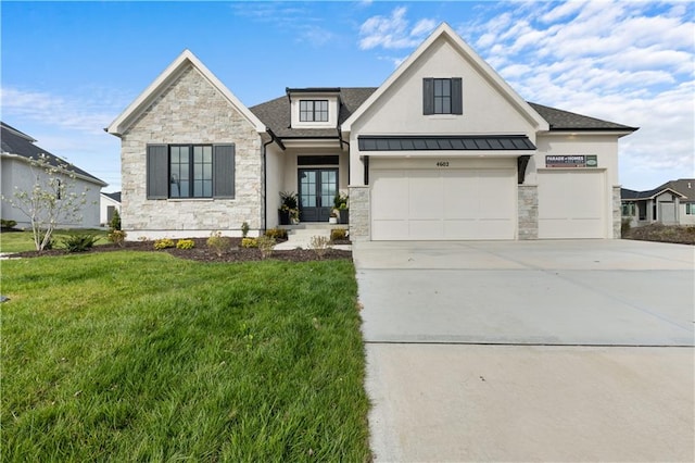 view of front facade with a garage and a front lawn