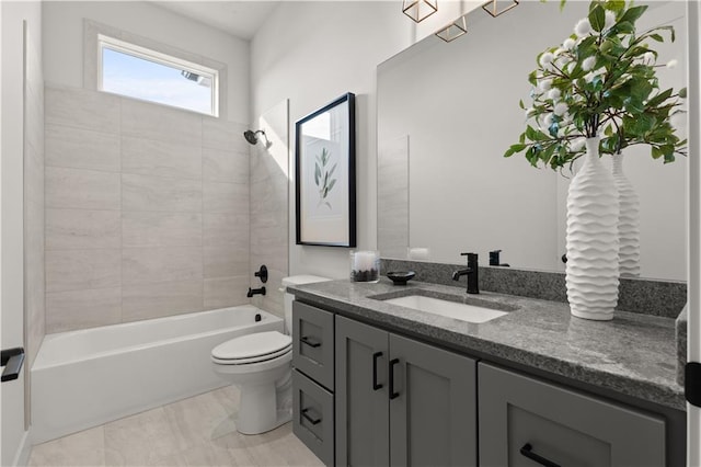 full bathroom with vanity, toilet, and tiled shower / bath