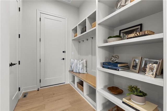 mudroom with light hardwood / wood-style floors